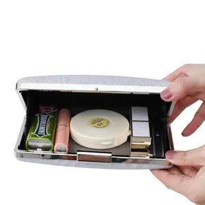 Sparkling silver glitter evening clutch bag with metal frame and internal storage space