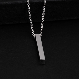 Detailed view of silver vertical bar pendant necklace in polished stainless steel finish