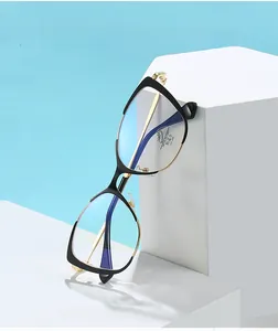 Detail of cat-eye black and gold metal frame with anti-blue light lenses and UV400 protection