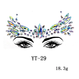 Macro view of AB iridescent acrylic face jewels in a symmetrical crown layout for parties