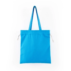 Close-up of blue canvas tote bag featuring double handles and drawstring closure detail