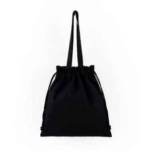 Close-up detail of a durable black canvas drawstring bag with sturdy textile handles