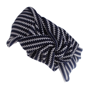 Close-up of blue and white zigzag knit headband featuring a stylish central knot design