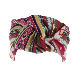 Detail of bohemian floral print knotted headband with elastic geometric pattern fabric