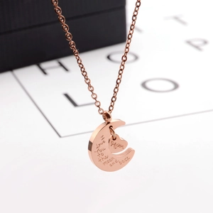 Close-up of rose gold Moon and MOM Heart pendant with Love You to the Moon and Back engraving