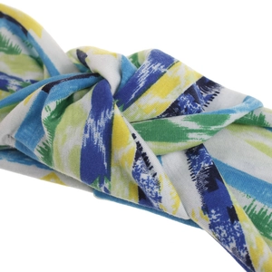 Close-up of twisted headband with colorful blue and yellow geometric bohemian patterns