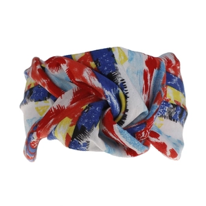 Detail of bohemian wide headband featuring artistic graffiti print and front knot design