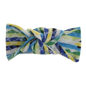 Detail of twisted headband with geometric print and vibrant yellow and blue patterns