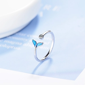 Silver open ring featuring blue enamel fishtail and sparkling cubic zirconia crystal