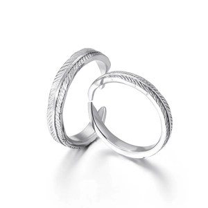 Adjustable sterling silver feather rings set with detailed textured engraving for couples