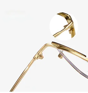 Detail of durable gold metal hinge and reinforced temple structure on cat-eye glasses