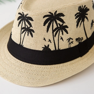 Straw Panama hat with black palm tree prints and a stylish decorative ribbon band