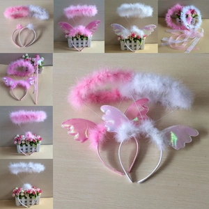 Detail of white and pink feather angel halo headbands and holographic wings set for party