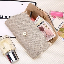 Internal view of a gold shiny shoulder bag with heart pendant showing storage space