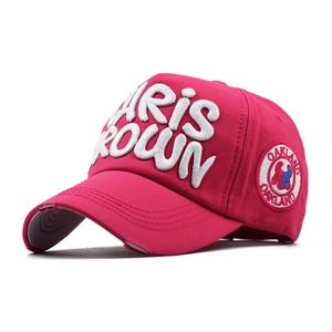 Detail of rose red cotton cap with thick 3D embroidery and vintage distressed brim finish