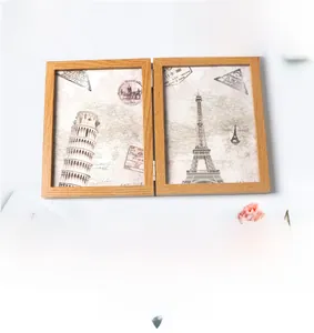 Detail of wooden folding double-sided picture frame displaying vintage European landmarks