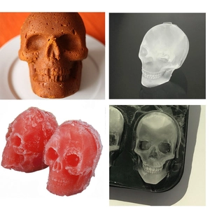 Silicone skull ice cube tray mold showing flexible black tray with 3D skull shaped cubes