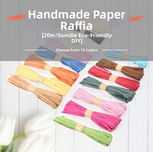 Detail showing 20m colorful raffia paper ropes for DIY crafts on white wooden background