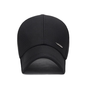 Black sport baseball cap with textured fabric and a silver metal logo on a white background