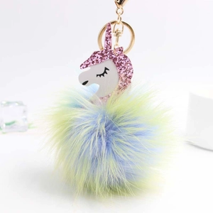 Colorful unicorn plush keychain with glitter mane and blue yellow gradient fur pompom