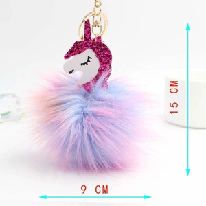 Detailed view of fluffy colorful unicorn keychain with 15cm dimensions and gold metal clasp