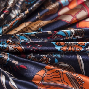Macro view of silk texture and colorful elephant pattern on the large square scarf