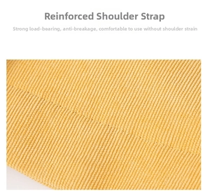 Close-up of reinforced shoulder strap on yellow corduroy tote bag with fine stitching