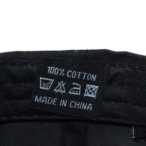 Detail shot of the internal 100% cotton wash label on the washed vintage baseball cap