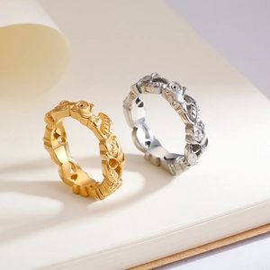 Romantic rose flower relief rings in gold and silver colors on minimalist background