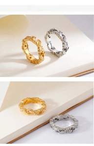 Close-up of vintage rose carved rings in gold and silver finishes with floral detail