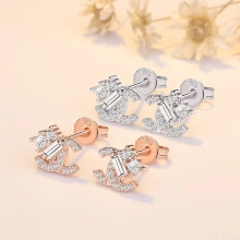 Macro shot of silver and rose gold S925 earrings with micro-paved sparkling cubic zirconia