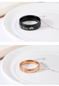 Detail of Her King and His Queen stainless steel rings with crown and zircon inlay