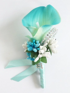 Detailed close-up of handmade teal calla lily boutonniere with rhinestones and ribbon
