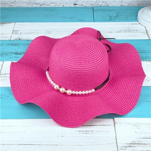 Women's foldable wide brim sun hat in rose red with pearl and black ribbon decoration