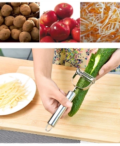 Detail of a stainless steel dual-blade peeler slicing cucumber for kitchen use