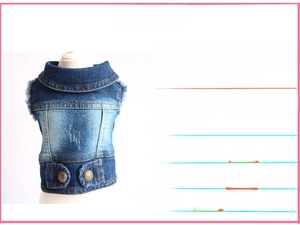 Detail of vintage blue washed denim pet vest with distressed texture and metal buttons