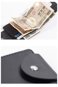 Detail of black leather wallet showing the metal money clip and secure snap button closure