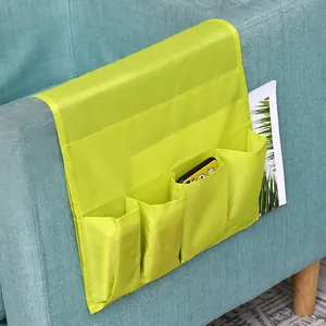 Neon green sofa armrest organizer with four pockets for remote and phone storage