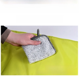 Detail view of grey bedside storage bag with reinforced hanging loop and durable edge