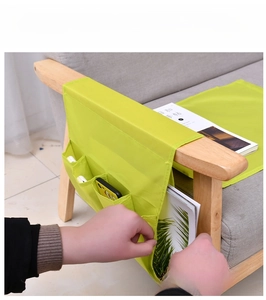 Green bedside organizer bag with multi-pockets for magazines and smartphone storage