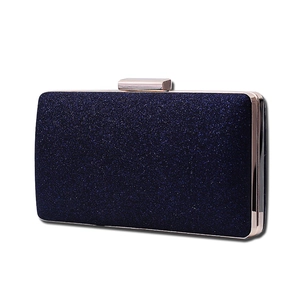 Elegant navy blue glitter evening clutch with rectangular gold metal frame and clasp