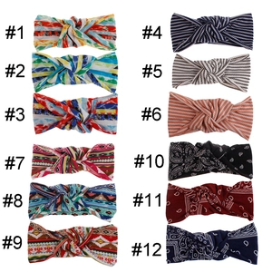 Grid view of twelve bohemian elastic knot headbands with various colorful floral patterns