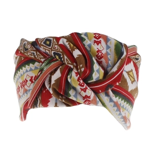 Detail of bohemian twist knot headband featuring ethnic geometric patterns in vibrant colors