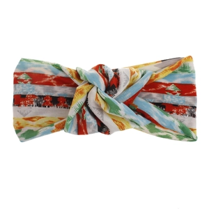Detail of bohemian twisted headband with vibrant colorful abstract geometric stripe pattern