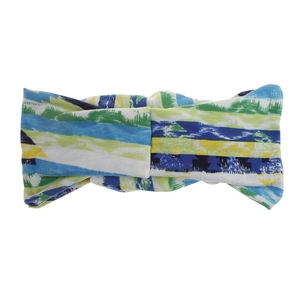 Close-up of wide bohemian knotted headband with colorful abstract brushstroke print