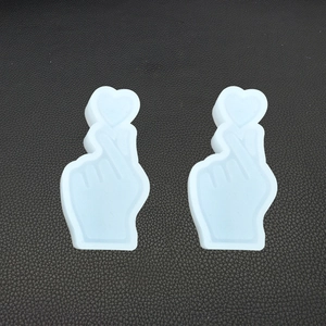 Detail view of two light blue silicone finger heart molds for resin and plaster DIY crafts