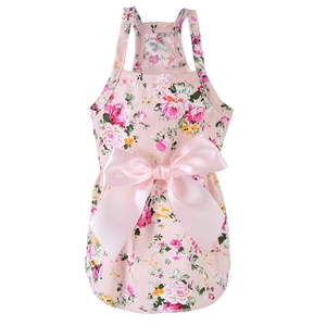 Close-up of pink floral cotton pet dress with a large decorative satin bow detail