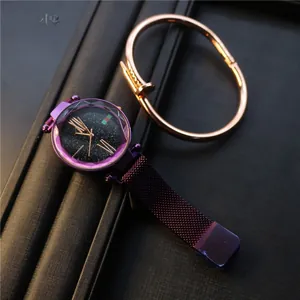 Close-up of starry purple watch with magnetic strap and golden nail bracelet set
