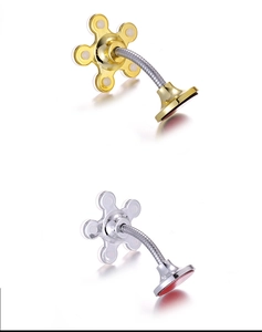 Detail of silver and gold flower-shaped suction cup phone holders with flexible arms