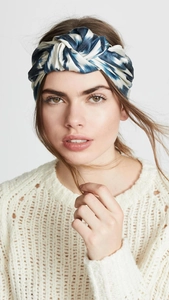 Detail of twisted headband with blue and white abstract tie-dye pattern on model